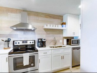 This modern kitchen is equipped with everything one needs to cook delicious meals, including a Flex Brew coffee maker and all the necessary coffee supplies. It is clean and neat, ready for you to enjoy in your short-term rental! #MiramarVactionRental