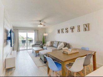 This cozy living room space has a spacious dining room table, cozy sleeper sofa, Smart TV plus great natural light. This is a great place for the whole crew to come together and make memories!