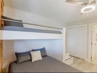 Talk about cozy! This custom-built twin over queen bunk isn't like any traditional bunk bed. With comfort front of mind, this room is bound to be a crowd-pleaser for all ages. Plus it has an ensuite bathroom for added ease.