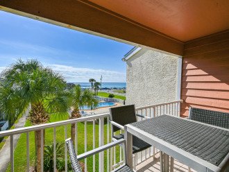 This stunning view from not only the patio but the living room, and primary bedroom of the pool and beach has it all!