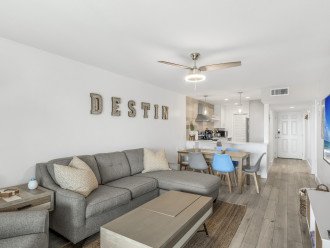 This Miramar Beach vacation rental is a bright and open concept space with a spacious living room, dining room, and kitchen.