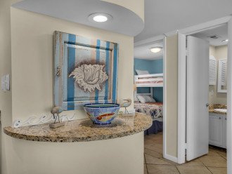 Guest bedroom has private access to shared hall bath-tub/shower combination.