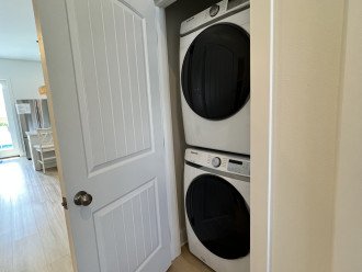 Large capacity Samsung HE Front Load washer and dryer located on first floor