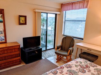 Master Bedroom desk, television, and balcony door