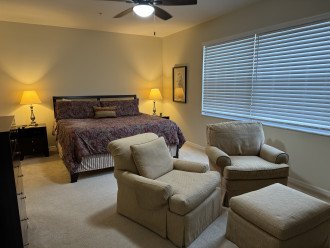Master bedroom has a king bed and separate sitting area