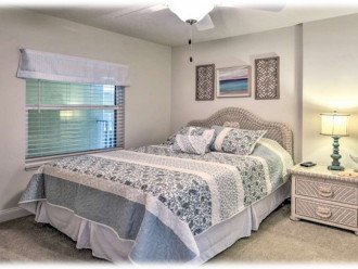 Queen bedroom with smart tv and attached bathroom