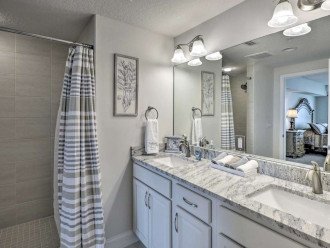 Master bath ensuite with dual sinks, walk-in shower and private water closet