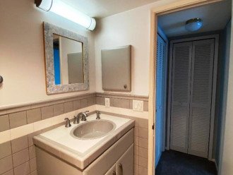 Den - Guest Bathroom custom cabinets, tile, enter from Den-Guest Bedroom hallway