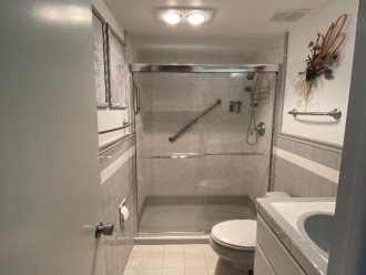 Den-Guest Bathroom - Kohler plumbing fixtures, heat lamp, vent, custom tile