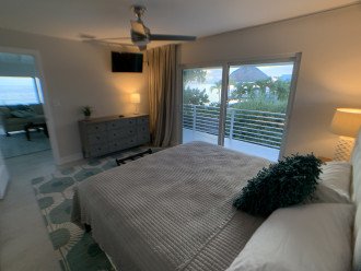 Bedroom 2 has views of water from side of bed /sliders