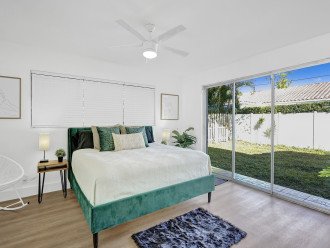 King size bedroom with ensuite Bathroom and sliders out to backyard