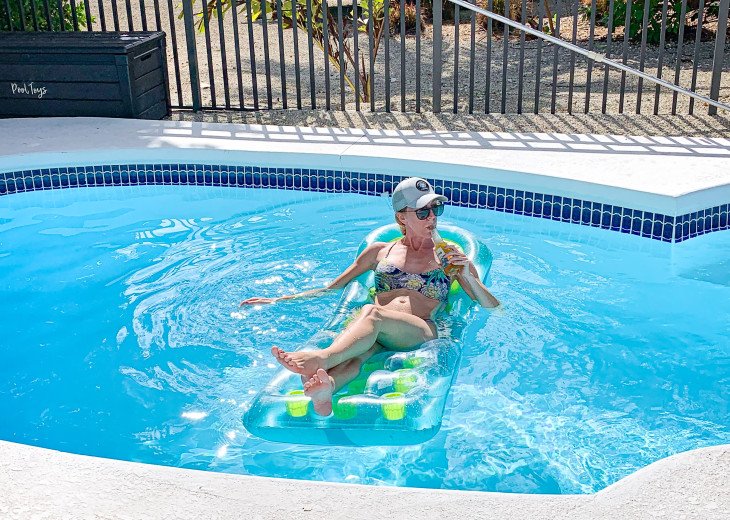 pool floats and toys available for use...she has the right idea on a sunny day