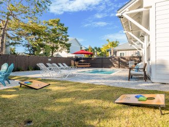 Play a game of corn hole in your backyard oasis