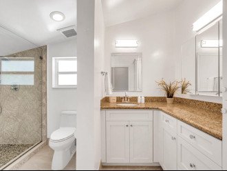 The upstairs bathroom features a walk-in shower.