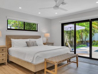 Master Bedroom comes with a King-sized bed, master bathroom and pool access.