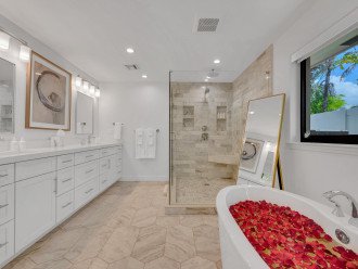 The master bathroom is spacious & updated. It includes a Soaking Tub and Walk-in Shower