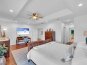 Alternative view of the bedroom and Smart T.V located above the office space.