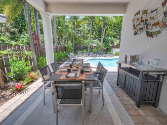 Outside, you will first be greeted by a small, shaded dining area, perfect for escaping the Florida sun.