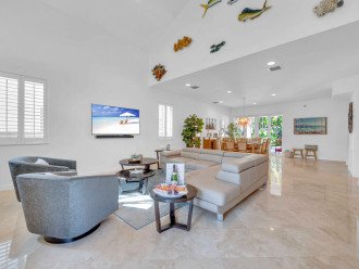 When you first enter, you will be greeted by the spacious living area of the Sun Key. Designed with entertainment in mind, the living area features plenty of comfortable seating surrounding a wall- mounted 65" Smart T.V .