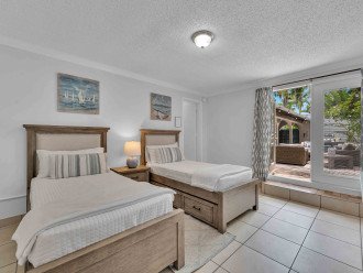 The third bedroom features two twin-sized beds and a Smart TV, too. It also has access to its own full en suite bathroom!