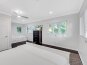 Bedroom five features a queen size bed, a trundle bed and a Smart TV.