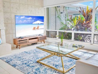 Enjoy the 75" Smart TV! of the living area