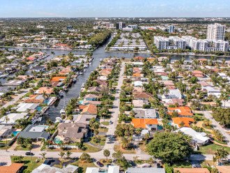 As you enter the neighborhood, notice the waterway as you wrap around walkable streets and neatly kept Florida style landscaping.