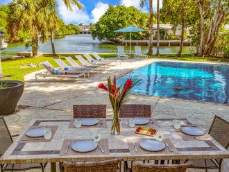Enjoy outdoor grilling and dining with seating for six, while taking in views of the heated pool and the waterway.