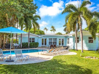 This quaint Floridian ranch style home features an ample garden with a heated pool and 180'' of waterfront.