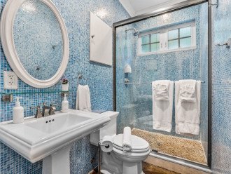 Bedroom Four's en suite bathroom features a walk-in shower