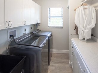 Spacious Laundry Room With High End Whirlpool Washer & Dryer