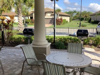 Covered area with grills at the neighborhood pool