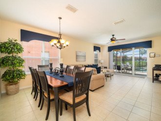 Family dining area with view of the pool and lake