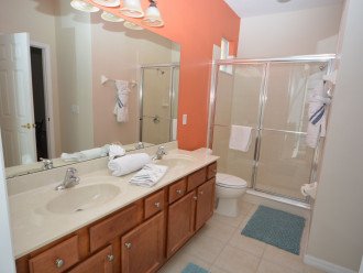 Ensuite bathroom with walk-in shower and two sinks