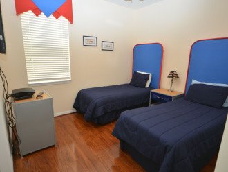 Twin room with TV can have plain bedding.