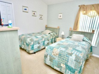 Bedroom four with twin beds with TV