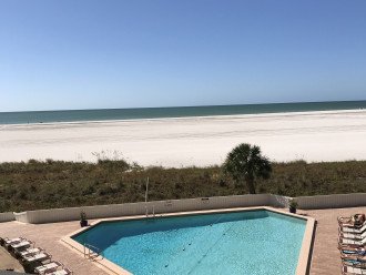 view from deck overlooking the pool and gulf of mexico