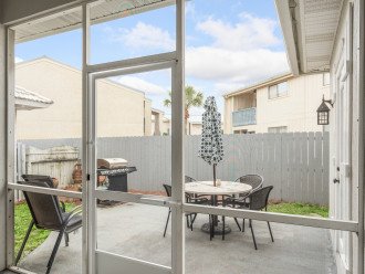 Outdoor patio area, fenced yard and gas grill