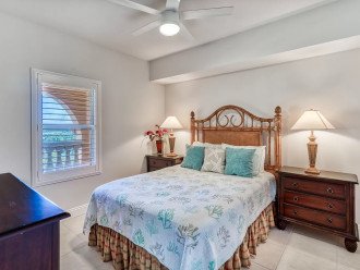 Serene guest bedroom with queen size bed, dresser, large closet & flat screen TV
