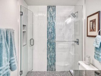 Beautiful guest bath's walk-in shower is large & spacious