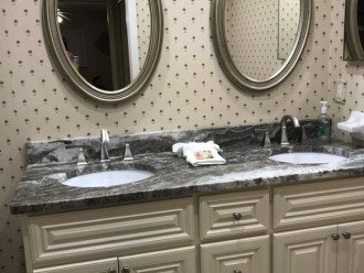 Newly remodeled 2nd bathroom with double sinks and freshly tiled tub/shower