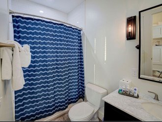 En suite bathroom off Bunk bedroom with shower/tub combo