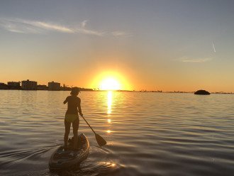 Paddle boarding from the condo into the sunset