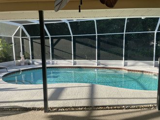 There is a covered porch as well as a screened in pool.