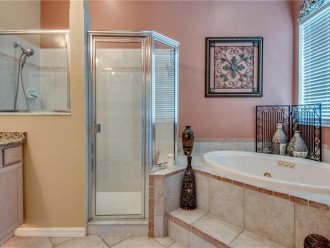 jetted master bath tub and spacious walk in shower
