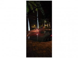 relax by the pool at night under the stars