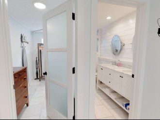 2 Spa Glass Doors Leading to the Walk-in Closet with full length Dressing Mirrors