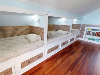 There are 3 Single Sleeping Berths on one side each with their own TV - A big hit with the kids