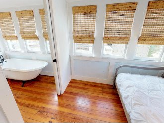 Sleeping Porch with pocket door to Bath and lovely Clawfoot Tub