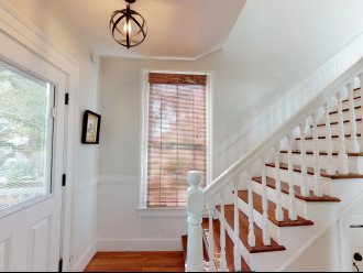 Heart of Pine Stairs lead to 3 Bedrooms and 3 Baths Upstairs
